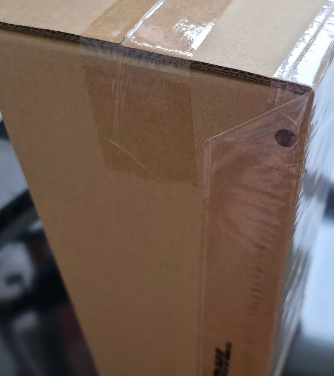 A tightly cropped anonymous brown shipping carton with no label or residential detail visible